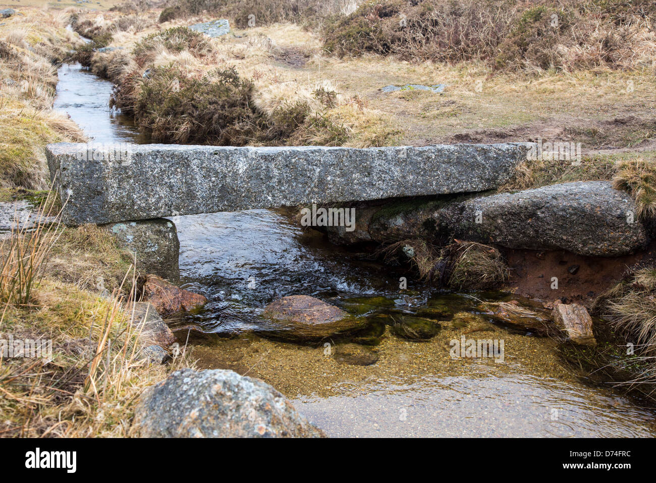Large granite block forming a bridge over a small stream, Dartmoor ...