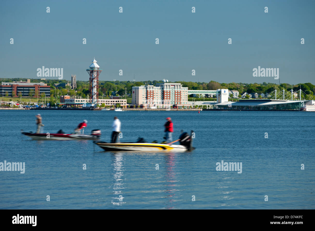 PEOPLE FISHING DOWNTOWN ERIE SKYLINE FROM PRESQUE ISLE STATE PARK ERIE PENNSYLVANIA USA Stock Photo