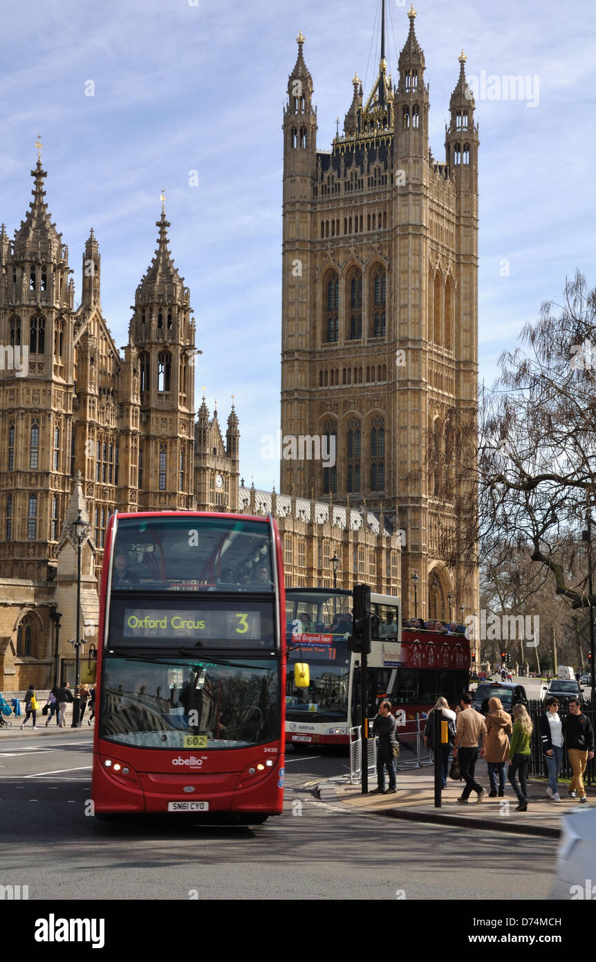 A London bus in front of Victoria Tower, Palace of Westminster, London,UK Stock Photo