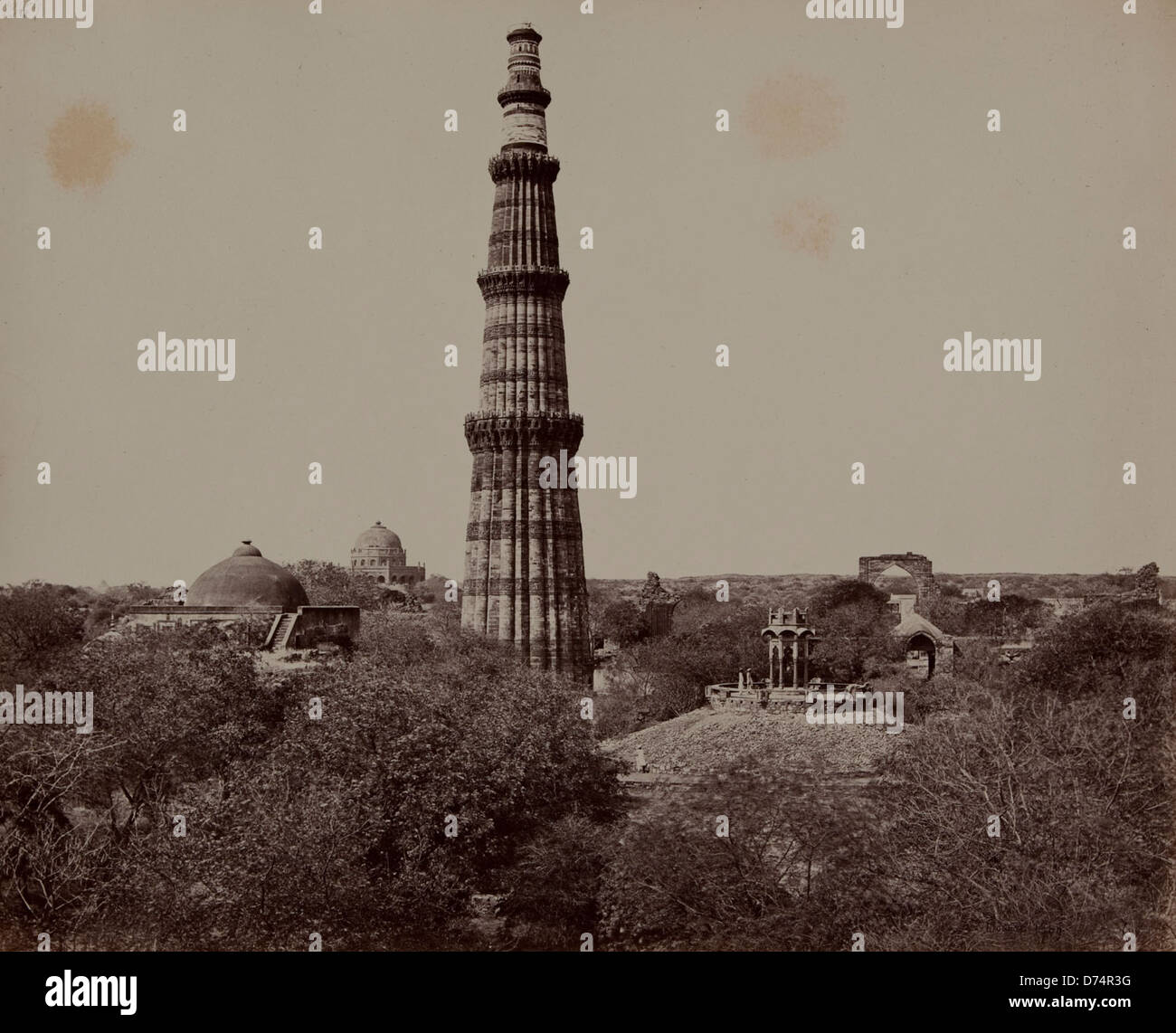 Delhi, the Kutub Minar and Surrounding Ruins Stock Photo