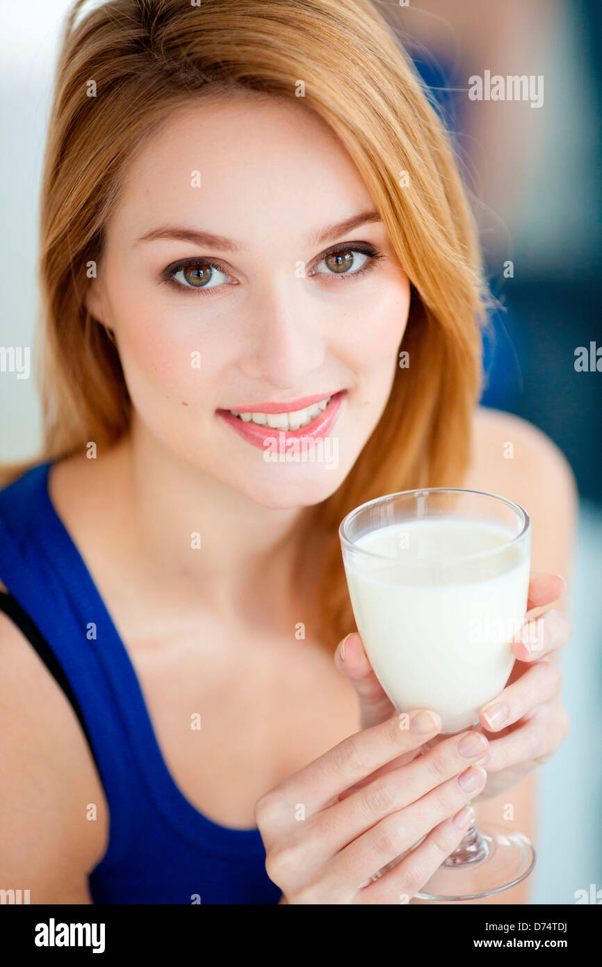 Woman drinking a glass of milk Stock Photo Alamy