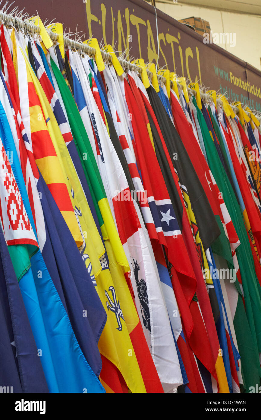 Funtastic colourful flags of the world hanging in kiosk stall at Guildhall Market, Bath Market, Bath, Somerset UK in April Stock Photo