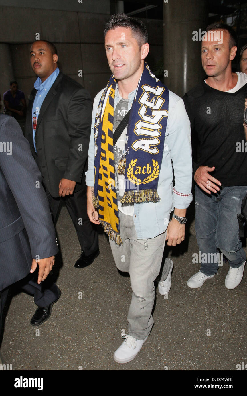 Robbie Keane meeting a large group of fans upon his arrival Irish footballer Robbie Keane, who plays as a striker for Los Stock Photo