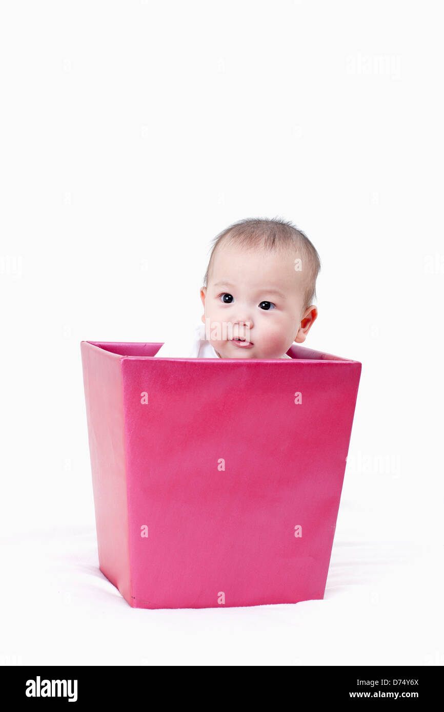 a baby inside a pink gift box Stock Photo - Alamy