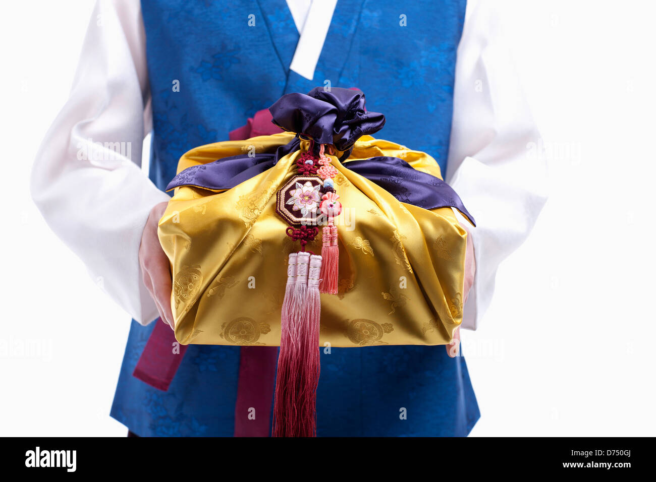 a man in Korean tradition costume holding traditional package Stock ...