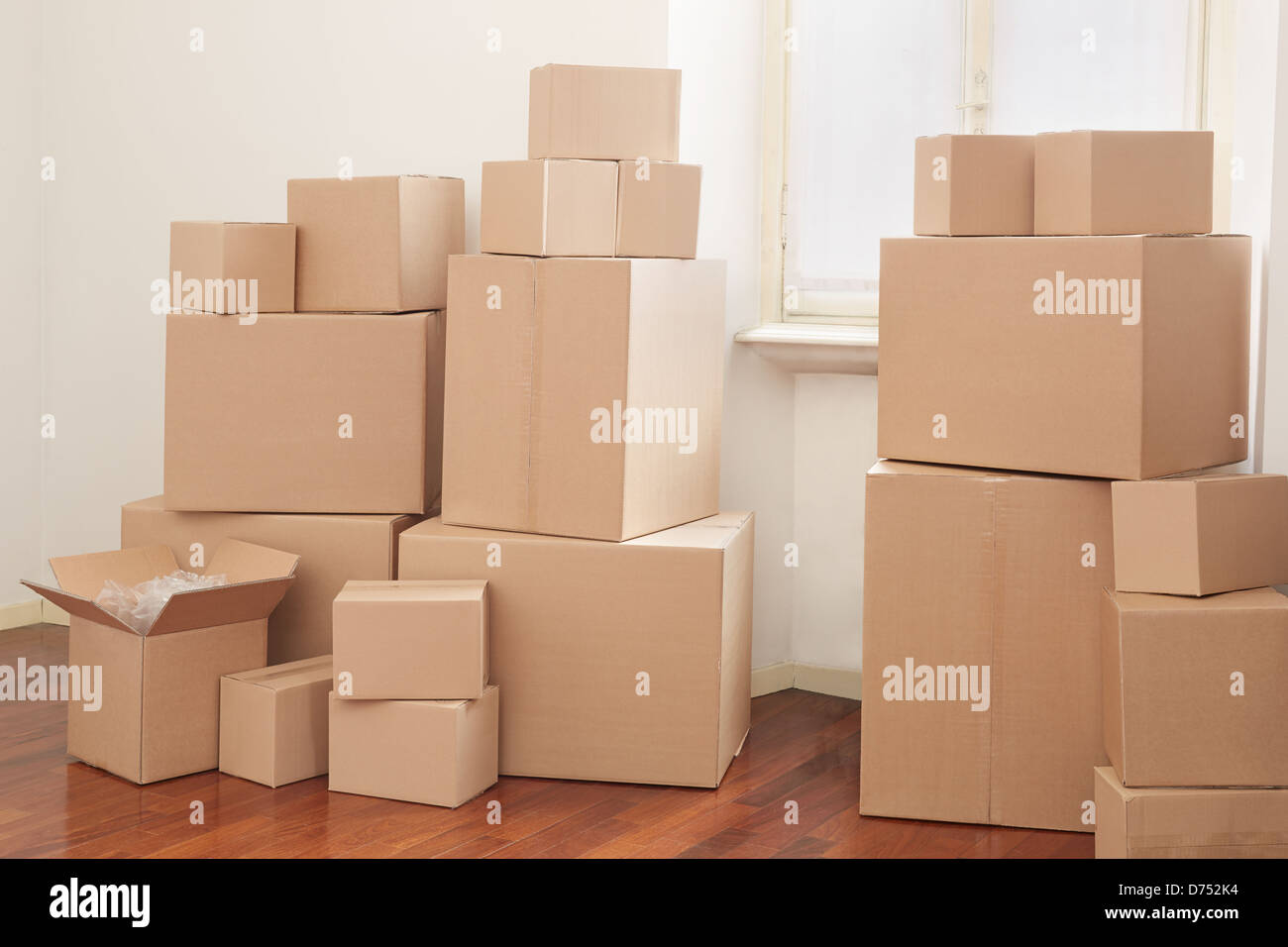 Cardboard boxes in apartment, moving day Stock Photo