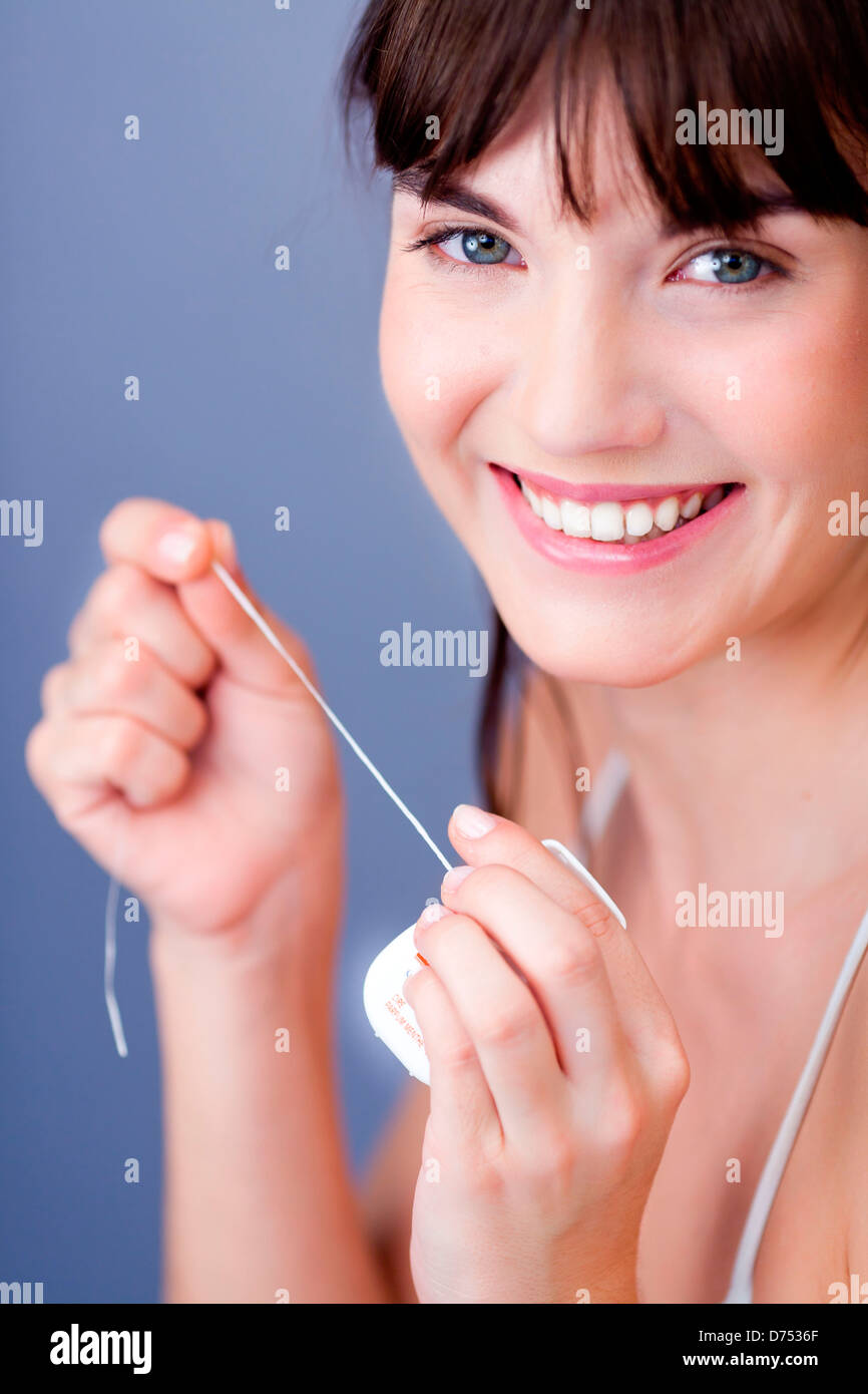 woman using dental floss Stock Photo Alamy