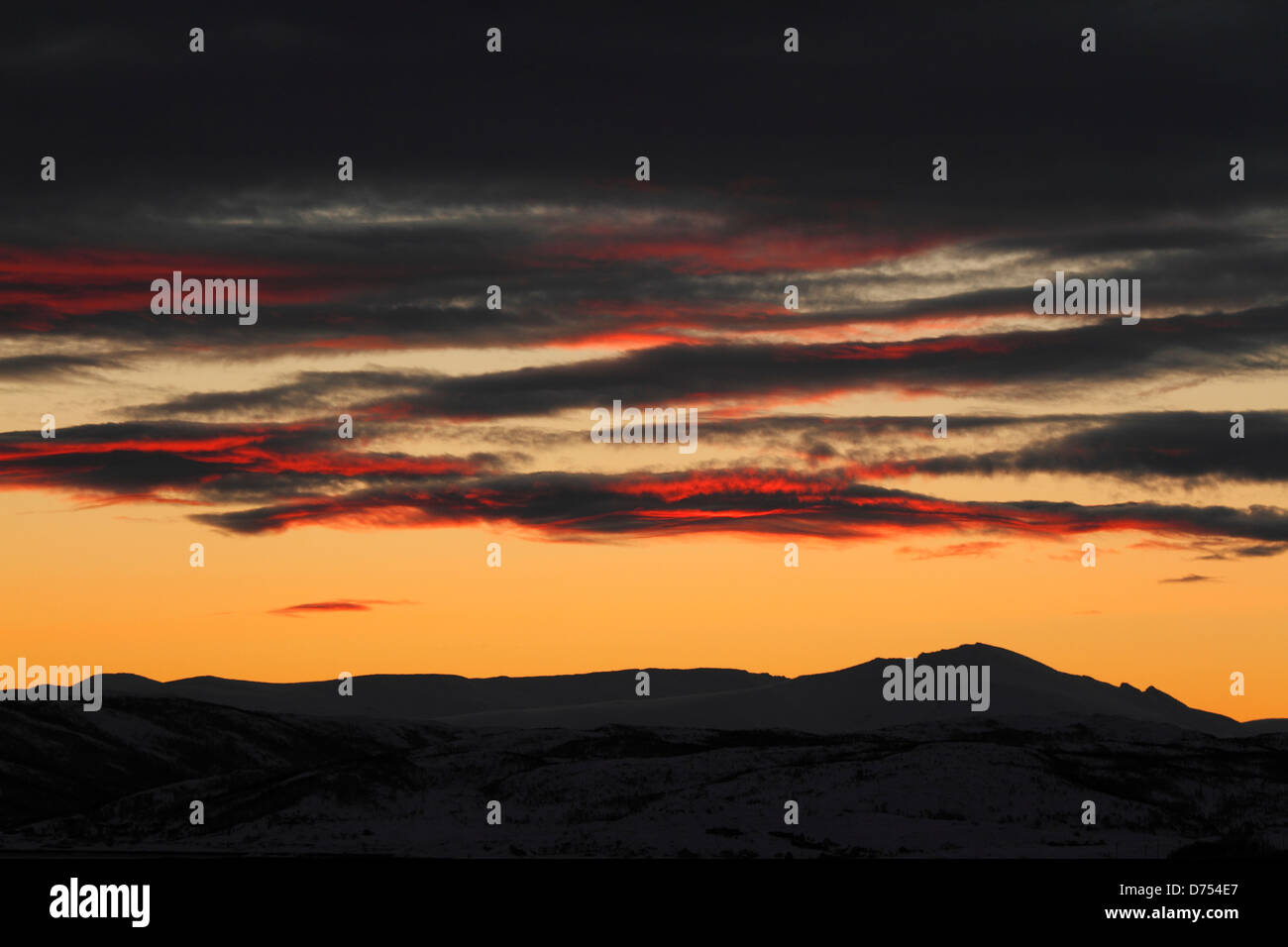 Orange sunrise in Kvaloyvagen, Norway. Stock Photo
