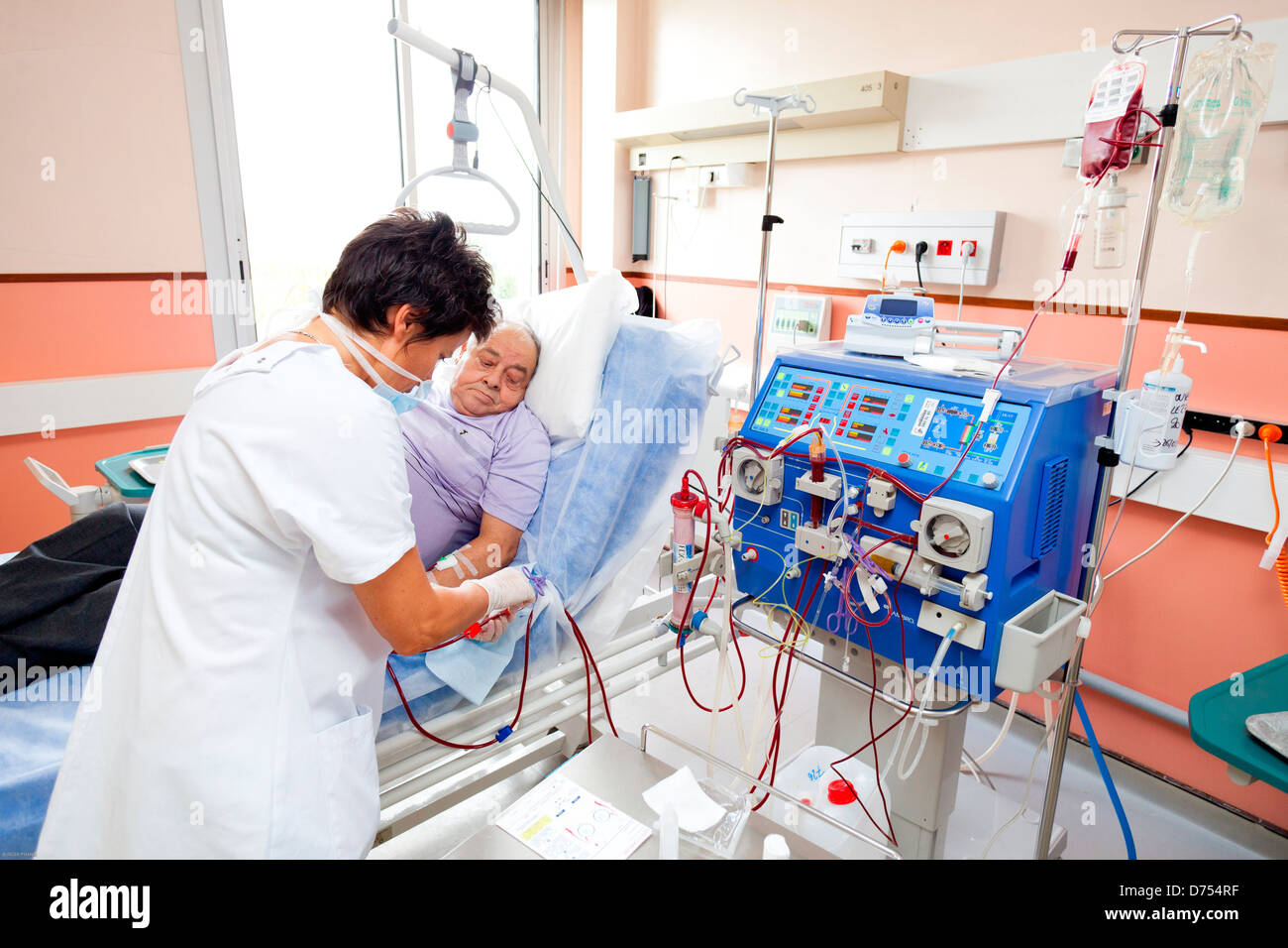 Blood transfusion anemic patient during hemodialysis session Nurse according protocol control Transfusion Limoges hospital Stock Photo