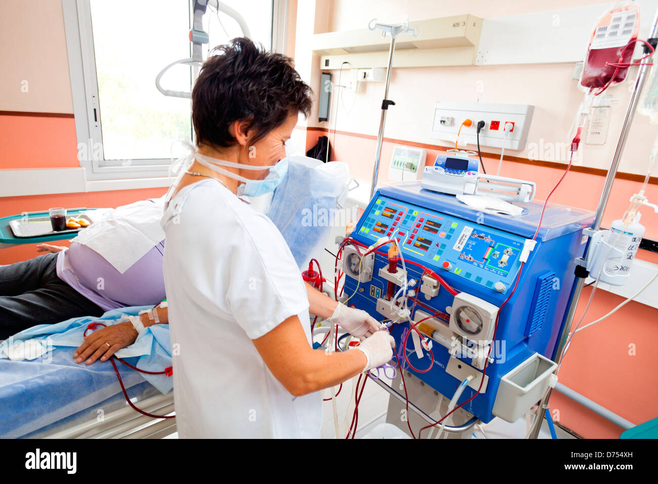 Blood transfusion anemic patient during hemodialysis session Nurse according protocol control Transfusion Limoges hospital Stock Photo