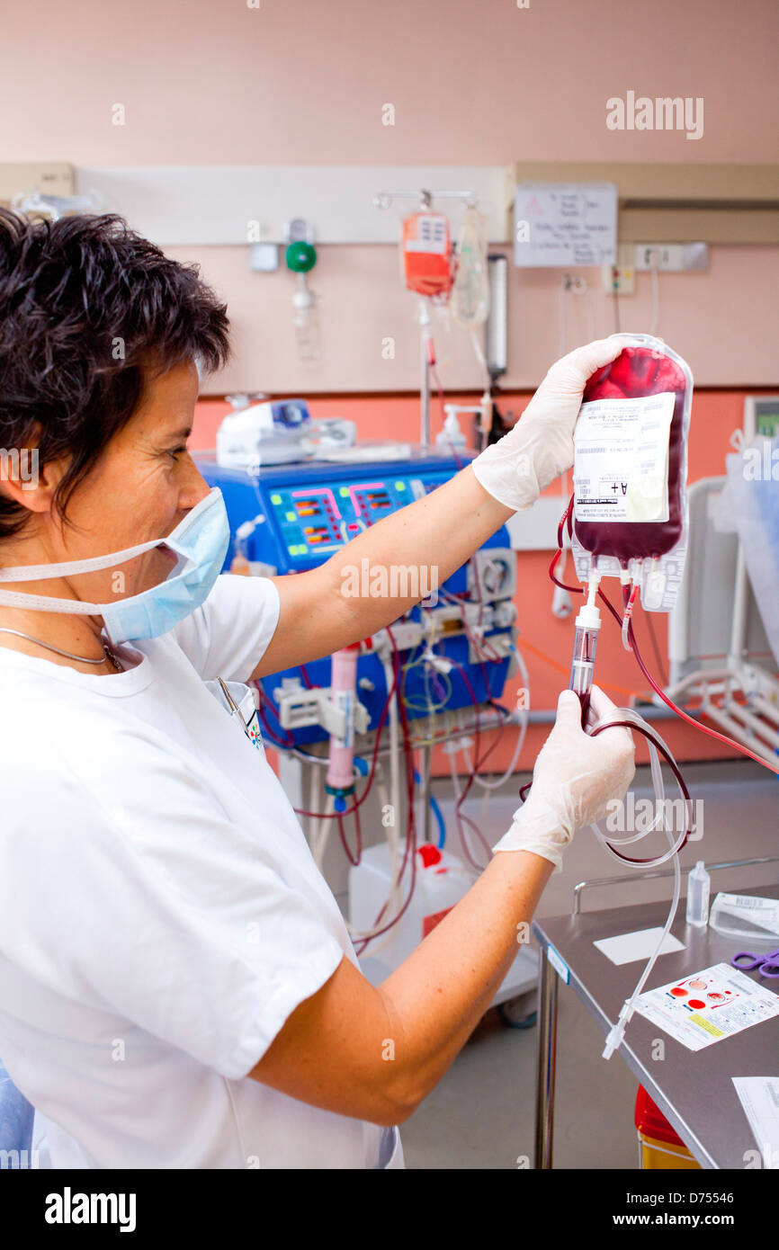Blood transfusion anemic patient during hemodialysis session Nurse