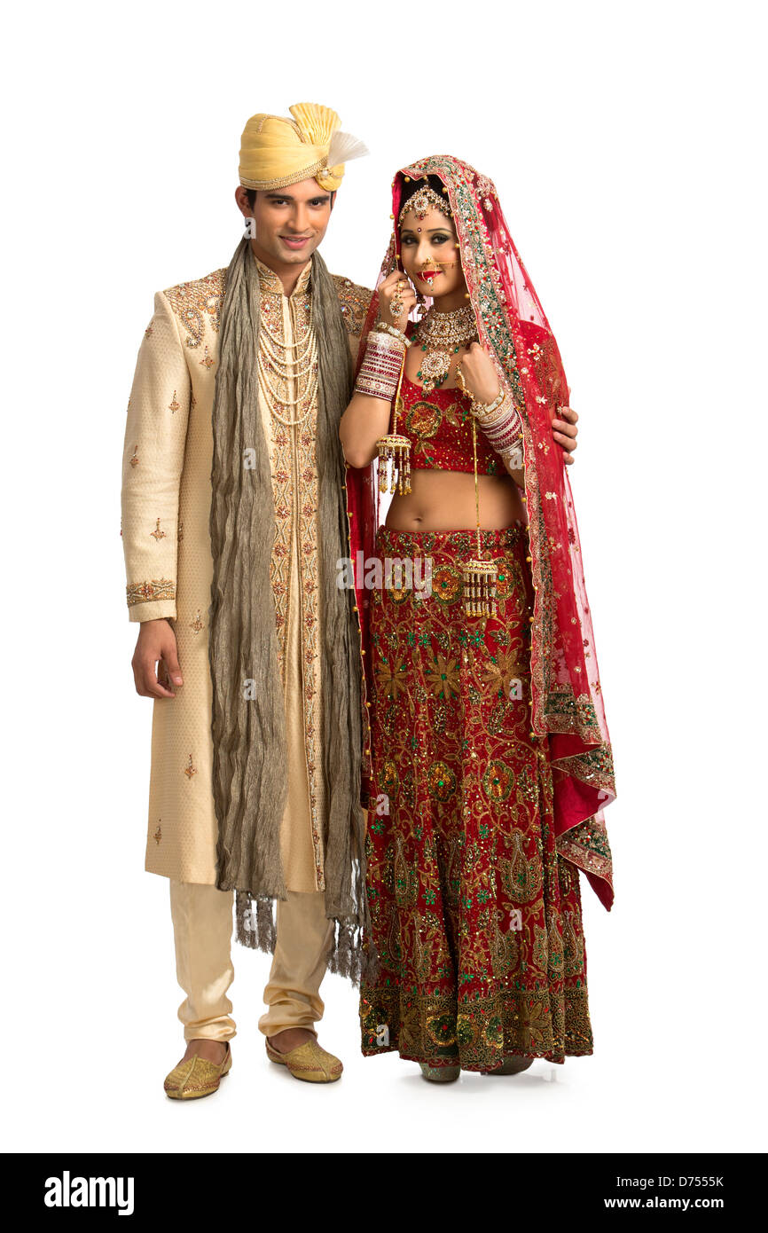 Indian newlywed couple in traditional wedding dress Stock Photo