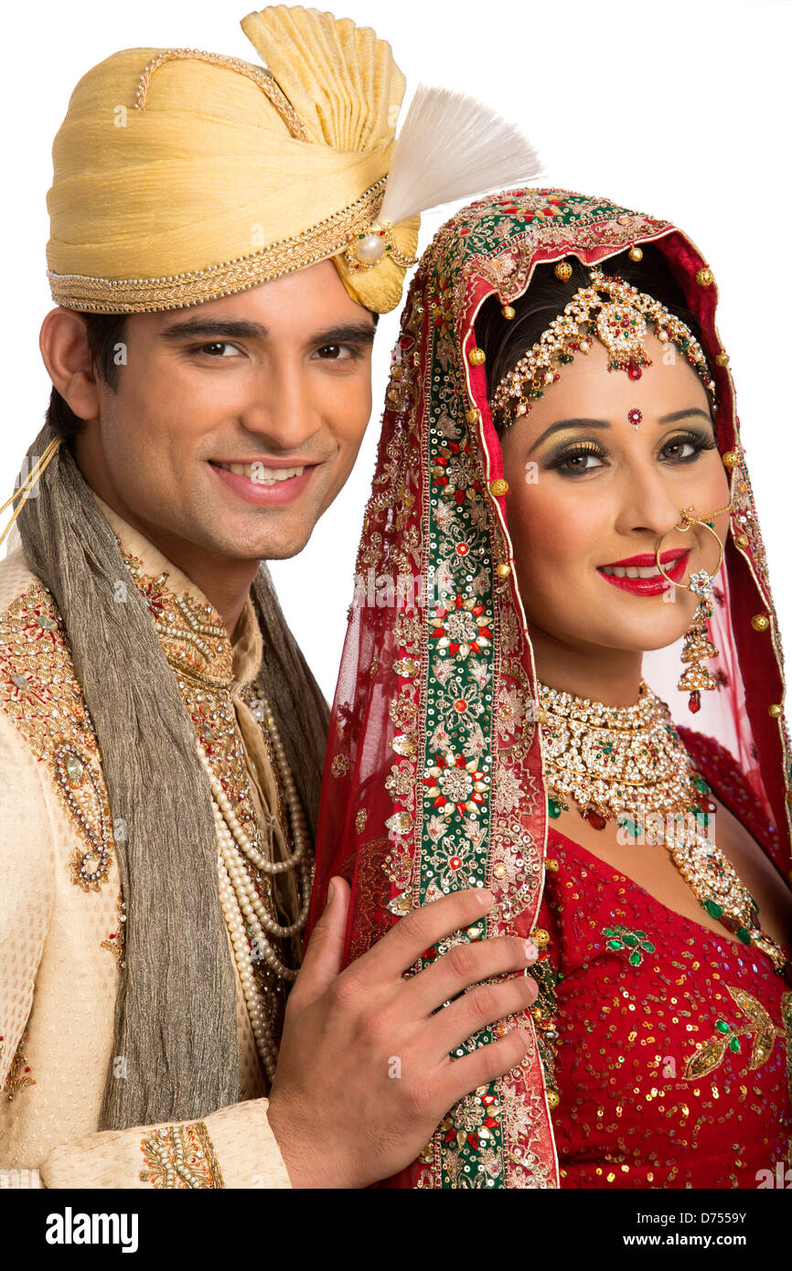 Smiling Indian newlywed couple in traditional wedding