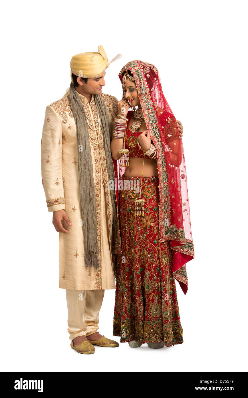 Indian newlywed couple in traditional wedding dress Stock Photo