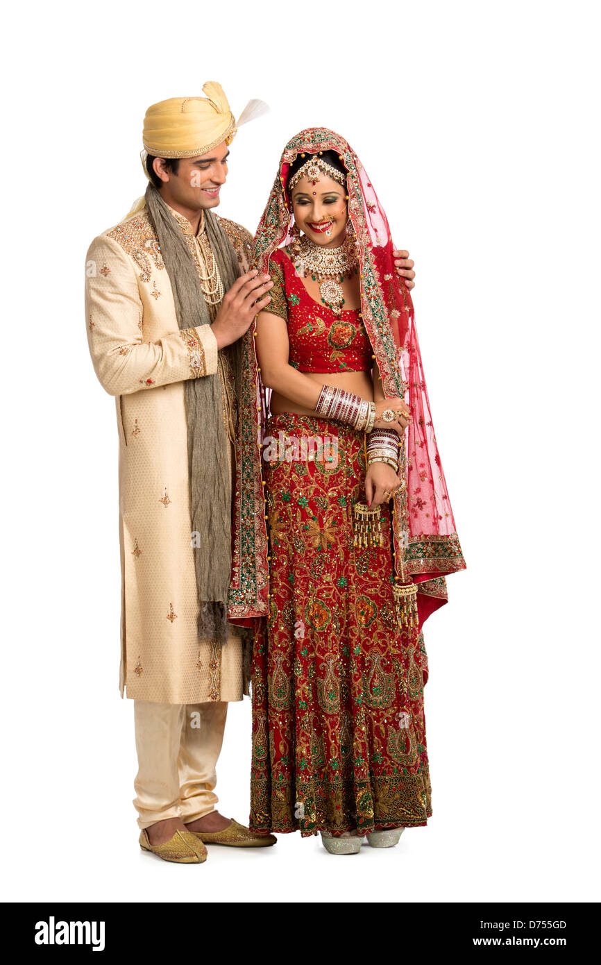 Indian newlywed couple in traditional wedding dress Stock Photo