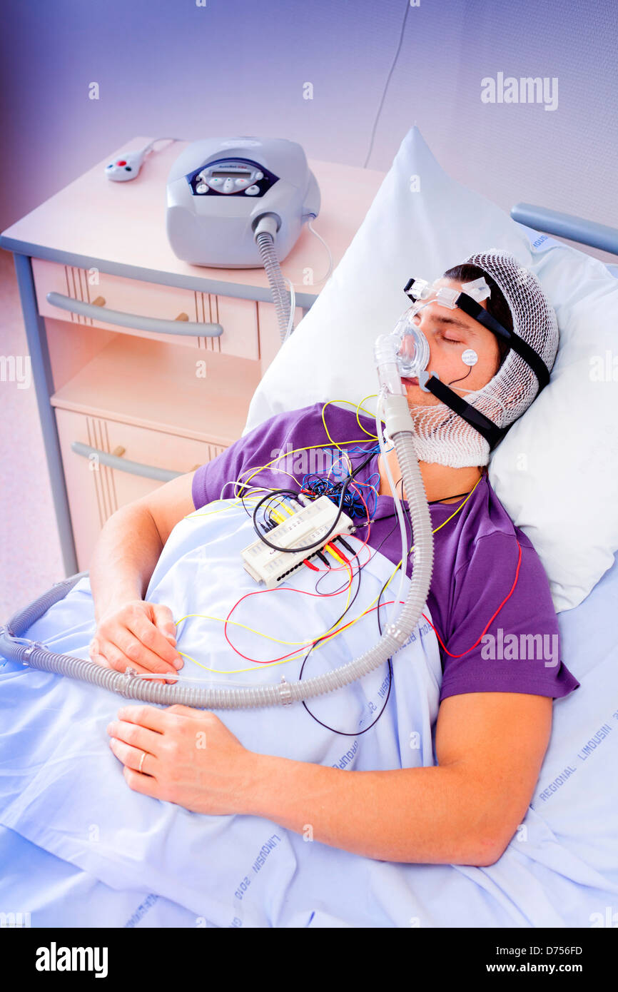 Patient suffering Obstructive Sleep Apnea Syndrome (OSAS) connected