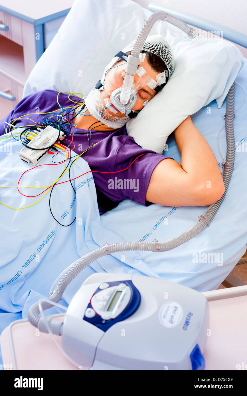 Patient suffering Obstructive Sleep Apnea Syndrome (OSAS) connected