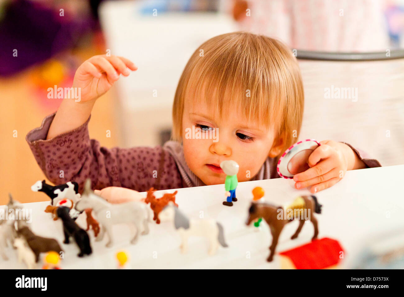 18 month old baby girl playing Stock Photo Alamy