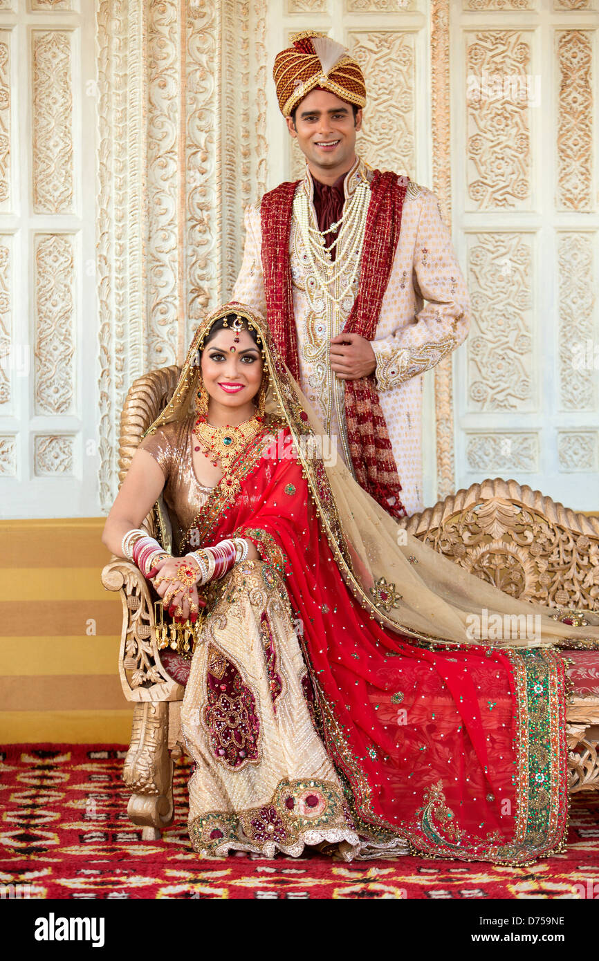 Indian bride and groom in traditional wedding dress Stock Photo ...