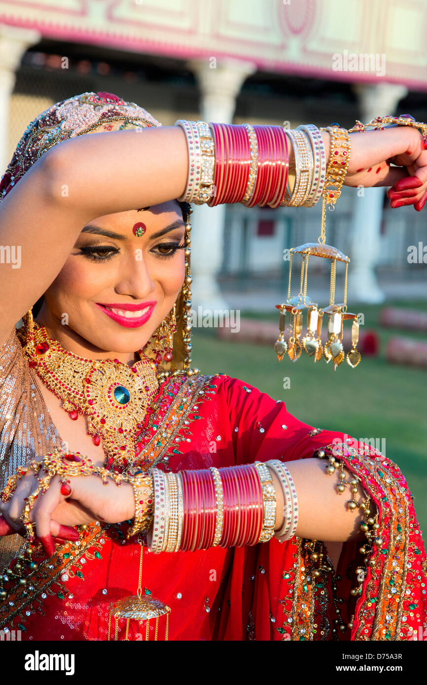 Beautiful Indian bride in traditional wedding dress and posing Stock