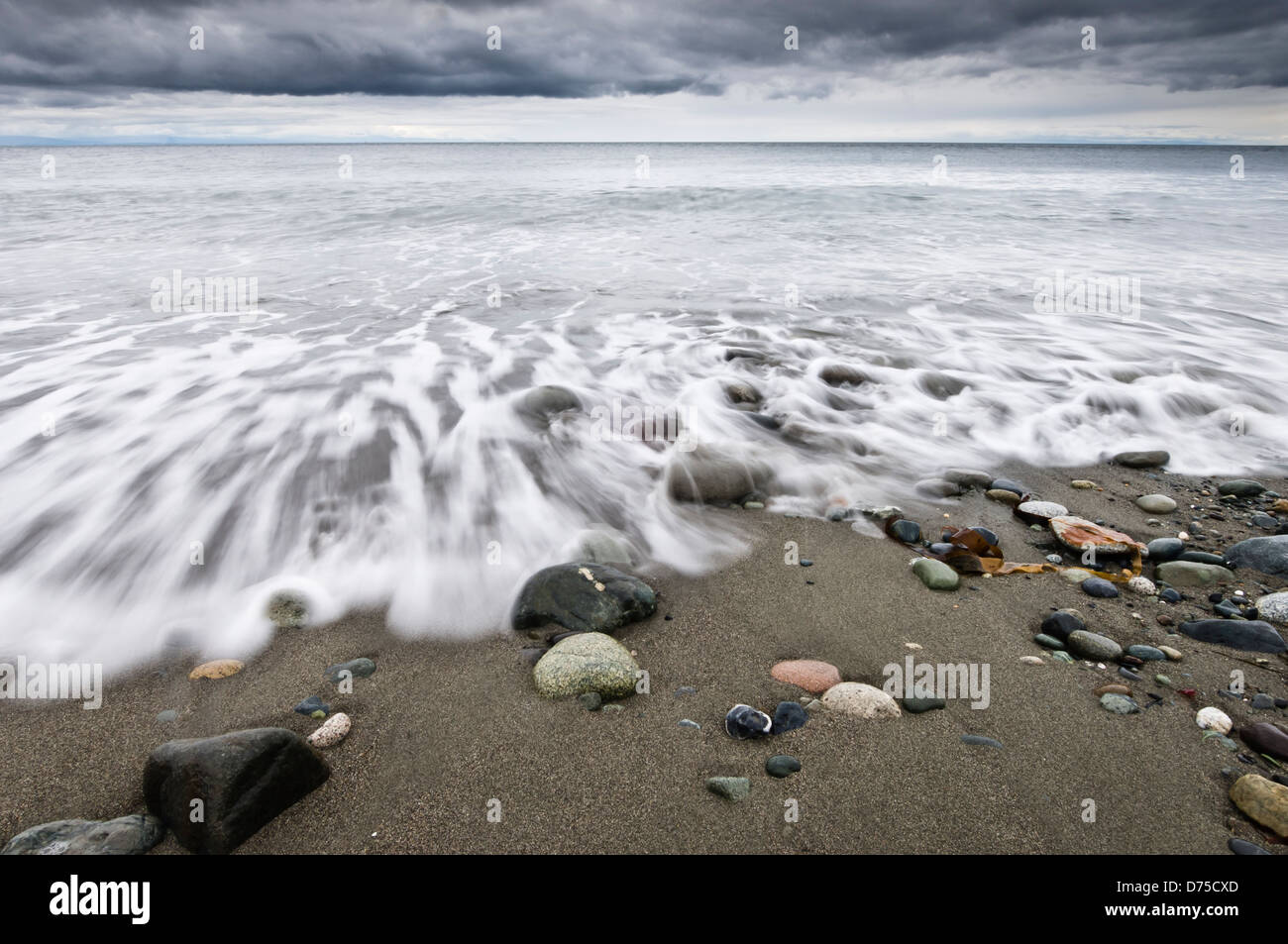 Waves wash up on the beach at Fort Ebey State Park, Whidbey Island, Washington, USA Stock Photo