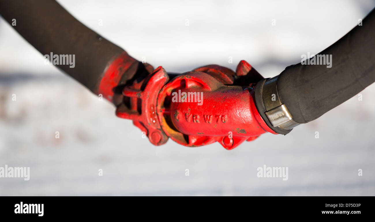 Closeup of train's highpressure pneumatic brakes hose coupling