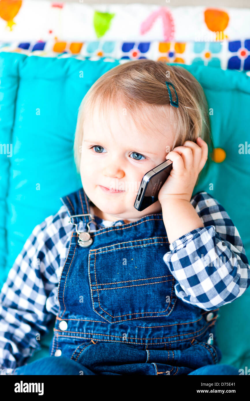 Cell phone baby girl month hires stock photography and images Alamy