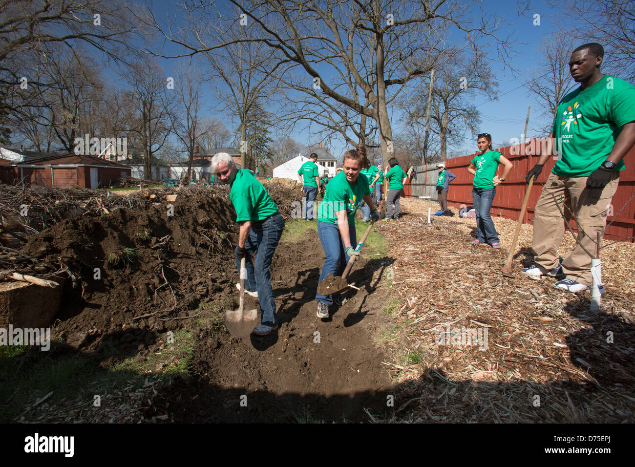 Volunteers prepare vacant land in Detroit for planting community garden Stock Photo