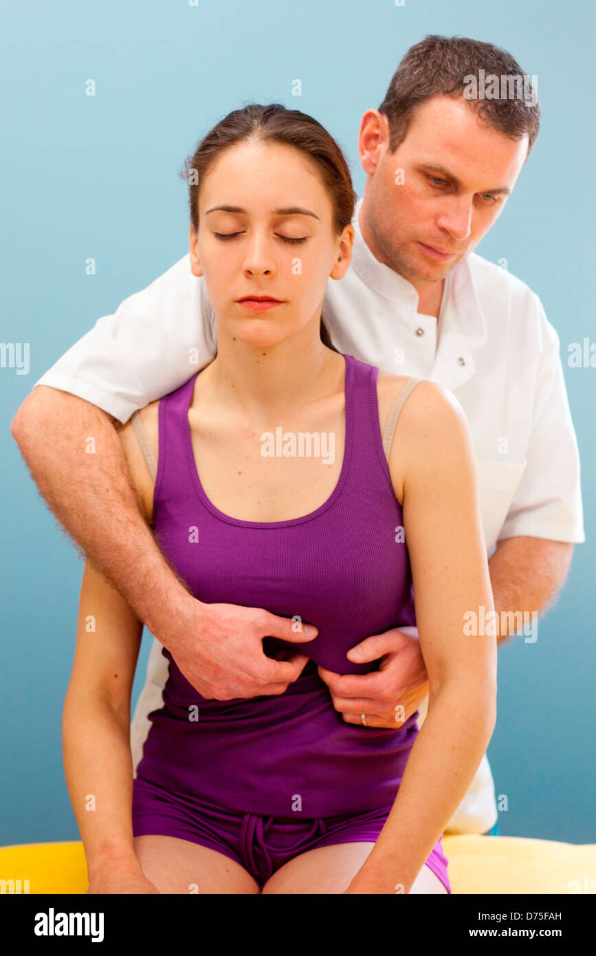 Visceral osteopathy session. Here, treatment of gastric disorders by