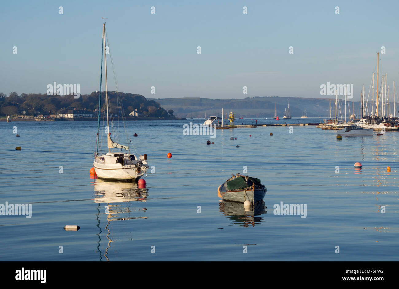 Small boats moored in the river at Cremyll Creek, Plymouth Sound, Devon UK Stock Photo
