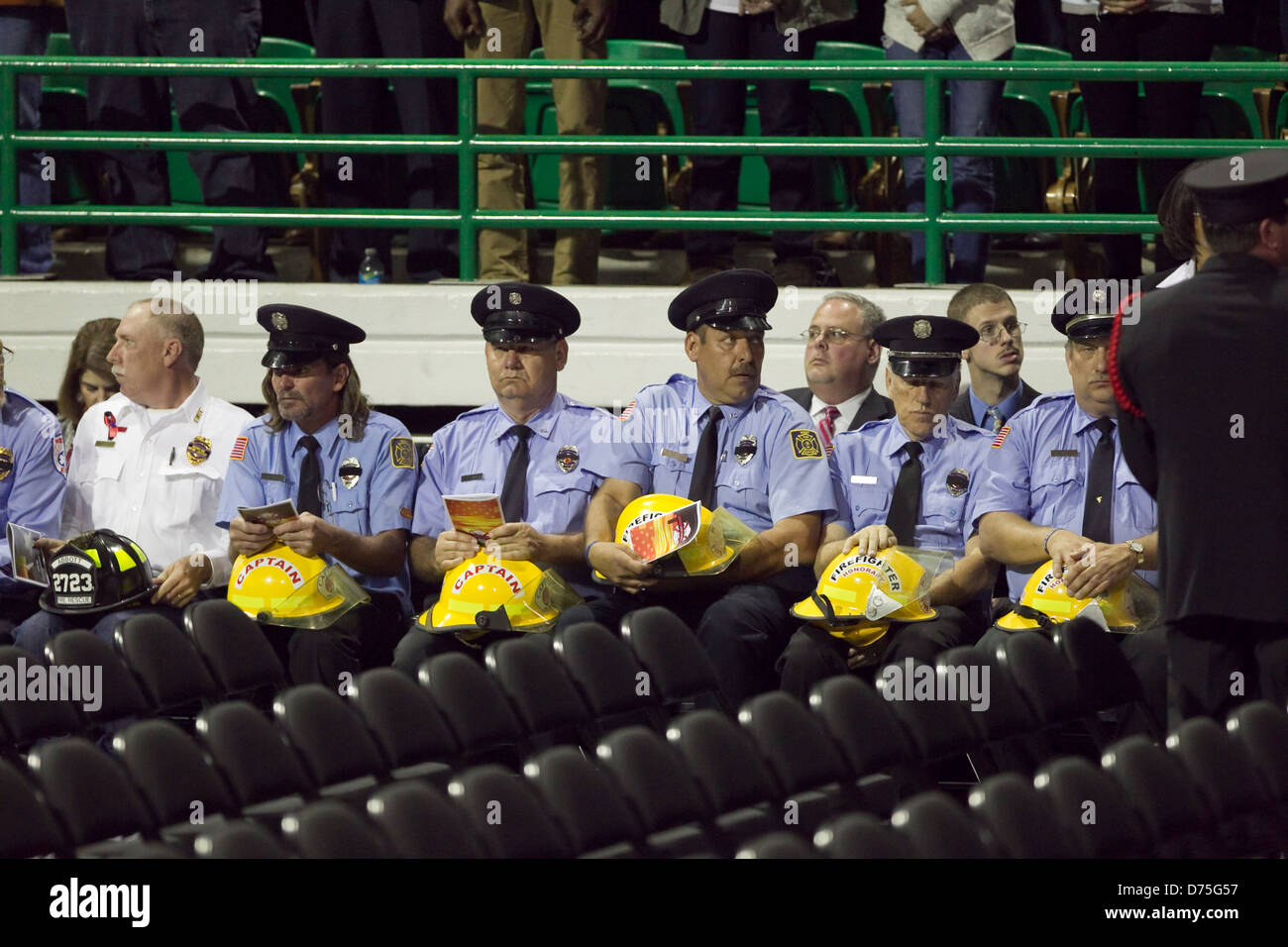 Firemen  with fireman hat sits in uniform to honor fallen firefighters who lost like in West, Texas fertilizer plant explosion Stock Photo