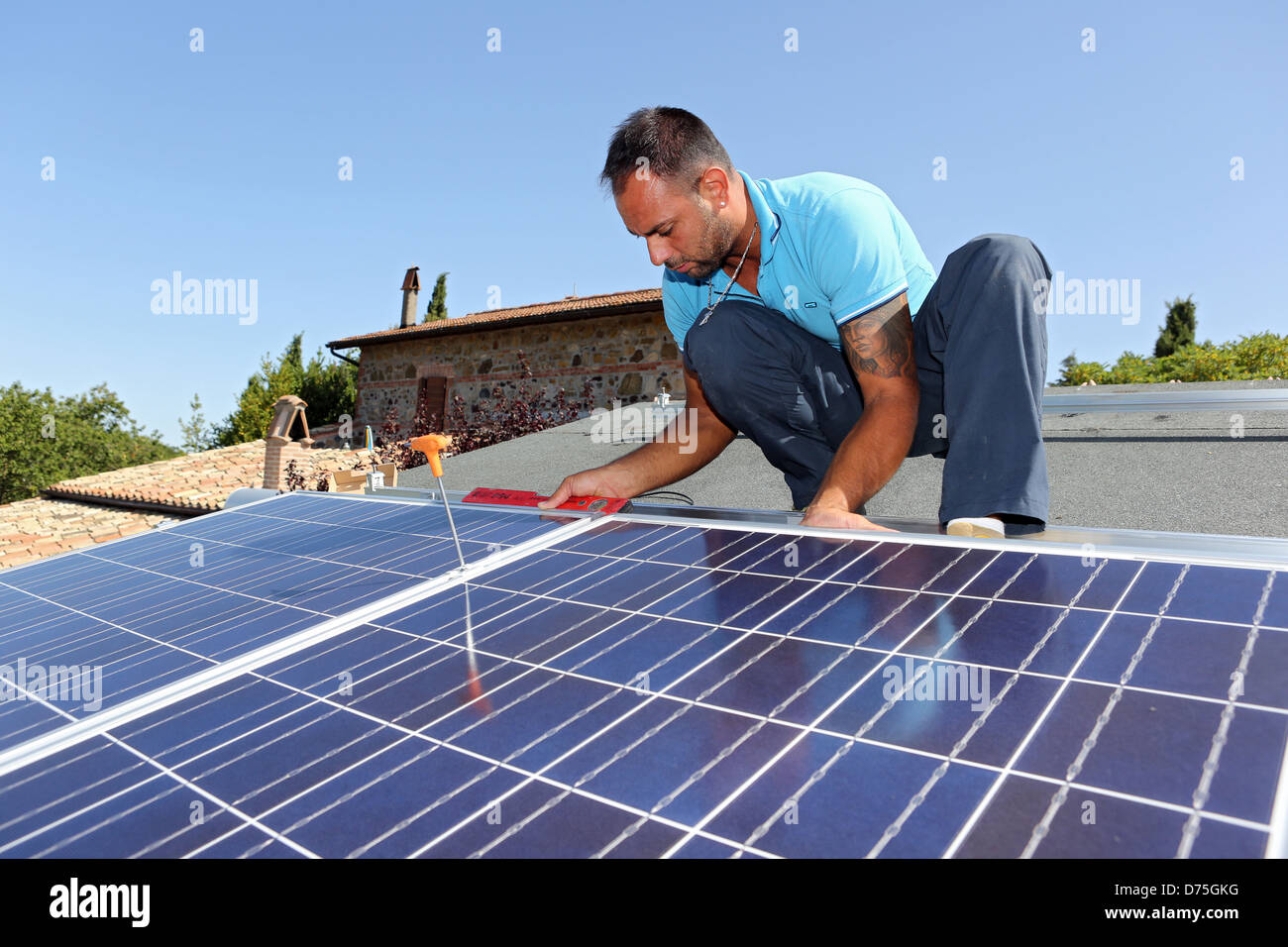 Torre Alfina, Italy, installing a solar power system on the roof of a detached house Stock Photo