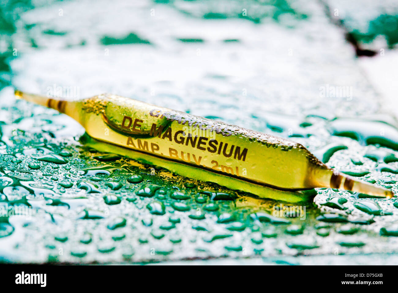 Glass ampoule of magnesium. Stock Photo