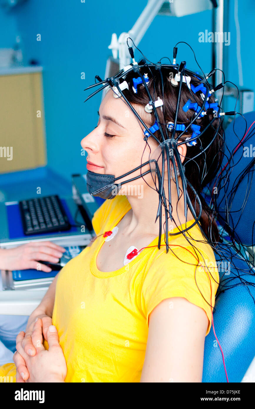 woman undergoing an electroencephalogram (EEG). Limoges hospital