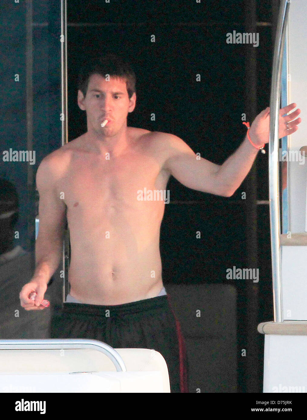 FC Barcelona footballer Lionel Messi is seen aboard a yacht enjoying his  holiday with his girlfriend Antonella Rocuzzo and Stock Photo
