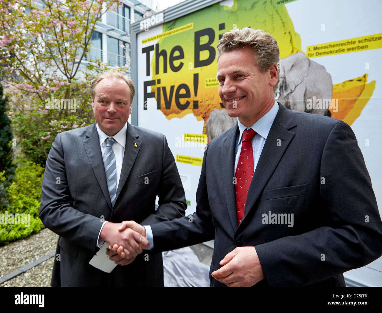Berlin, 29 April 2013. Start of the national campaign 'The Big Five' with Dirk Niebel. Dirk Niebel, Federal Minister for Economic Cooperation and Development and Eberhard Brandes, CEO of WWF Germany, present the new nationwide poster campaign 'The Big Five' of the Federal Ministry for Economic Cooperation and Development. / Development Minister Dirk Niebel shakes hands with Eberhard Brandes, CEO of WWF Germany, at the Start of the national campaign 'The Big Five' in Berlin. Credit:Reynaldo Chaib Paganelli/Alamy Live News Stock Photo