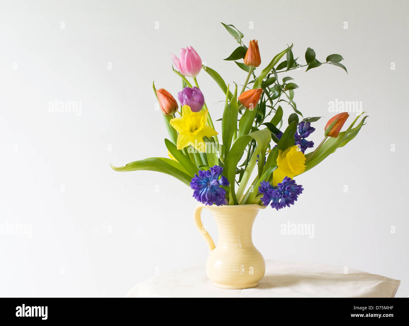 Daffodils, Hyacinths, tulips still life in vase Stock Photo - Alamy