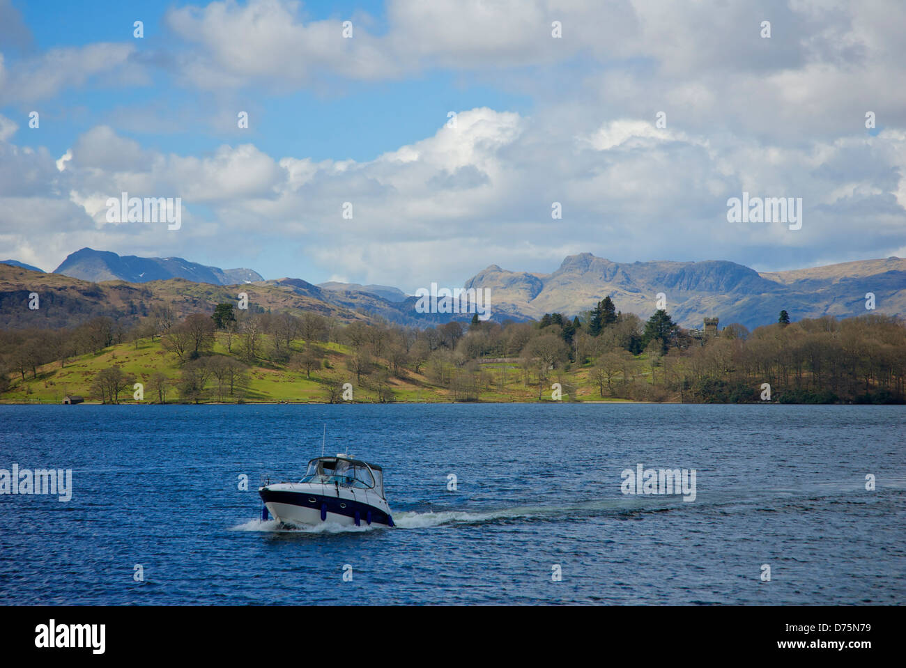Boat on Lake Windermere, with Langdale Pikes and Wray Castle in the