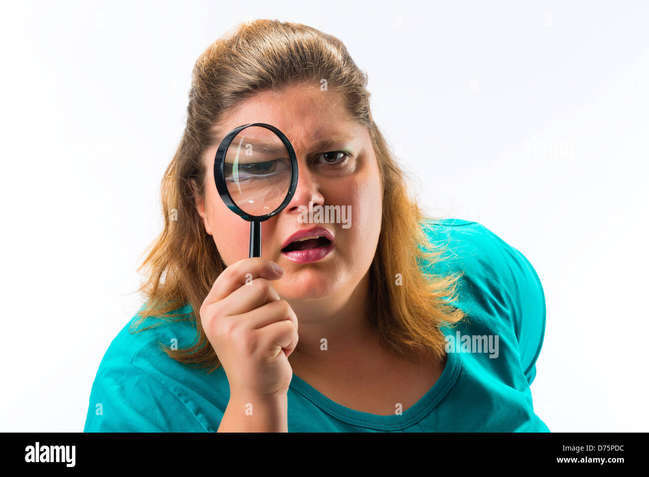 Woman looking through magnifying glass or loupe Stock Photo - Alamy
