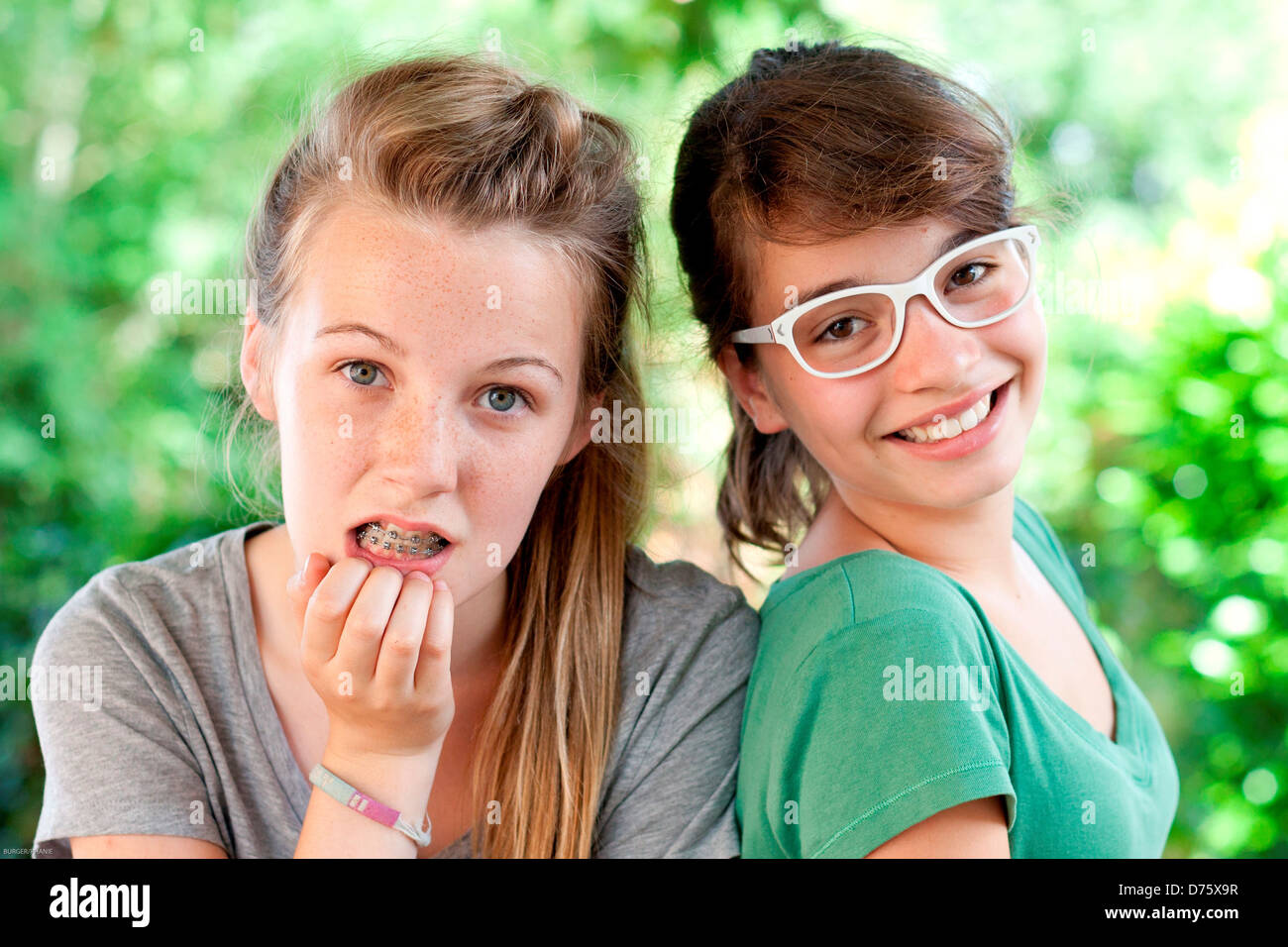 Teenage girls wearing glasses and dental braces Stock Photo Alamy