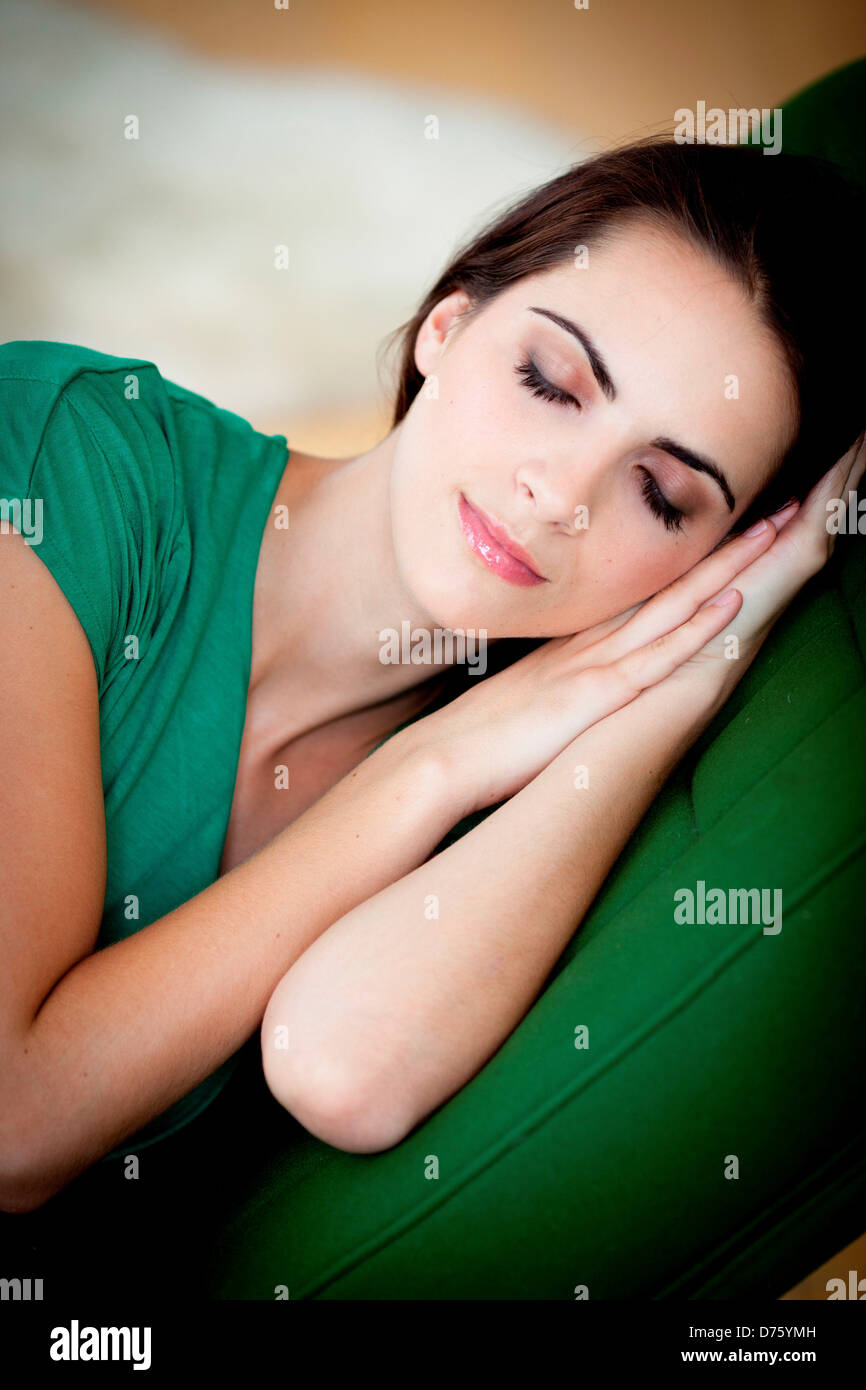 Woman relaxing on couch. Stock Photo