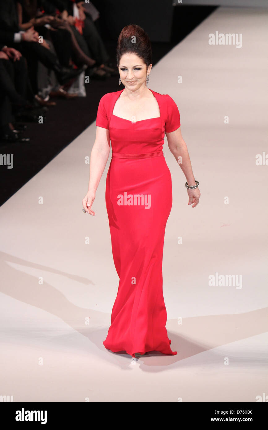 gloria estefan red dress In an exclusive moment with HOLA!, Gloria Estefan shared her excitement during the 51st American Music Awards, where she appeared radiant alongside her husband, Emilio Estefan. The iconic couple