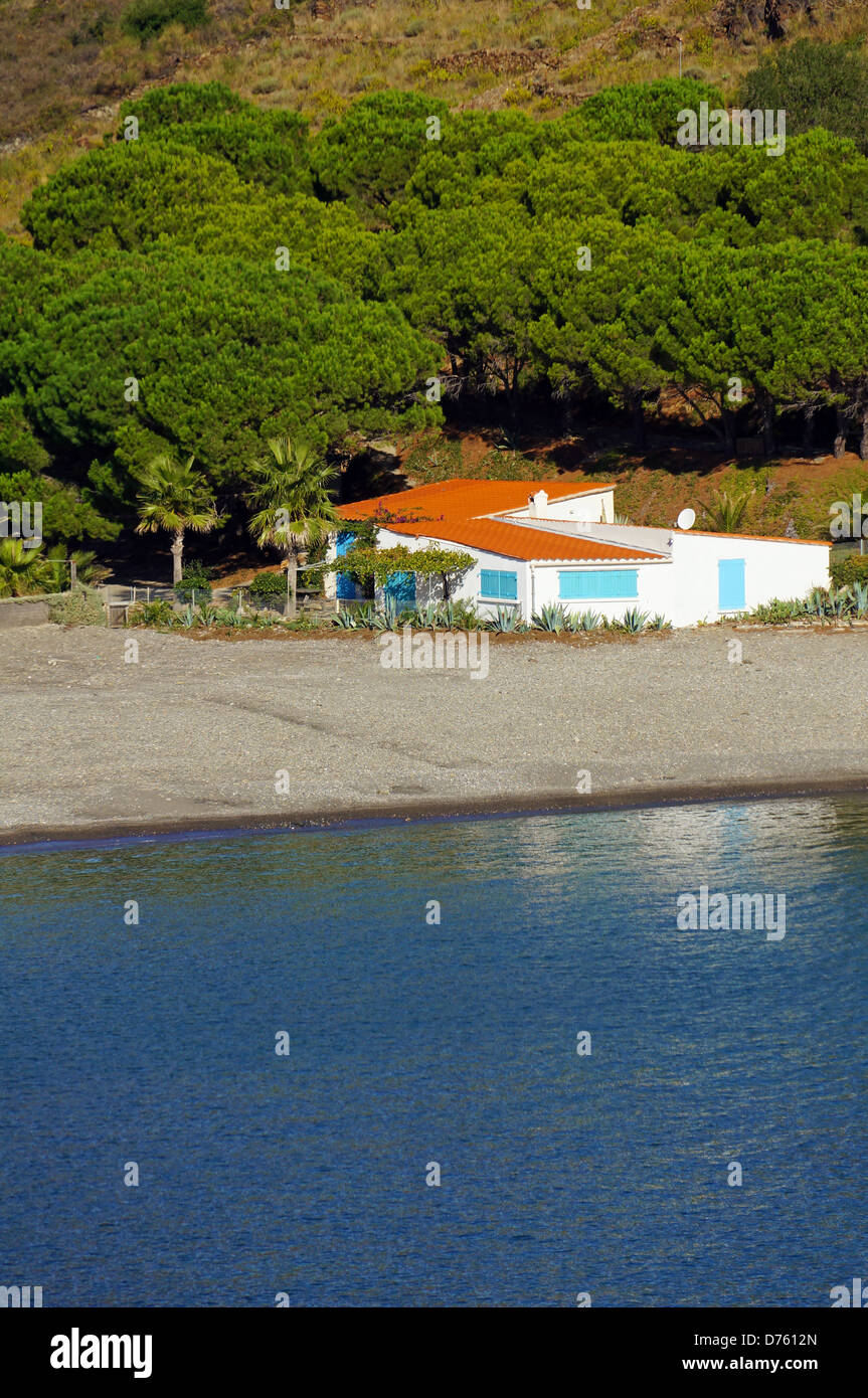 Typical waterfront Mediterranean house with the sea in foreground, cove of Peyrefite, Vermilion coast, Roussillon, France Stock Photo