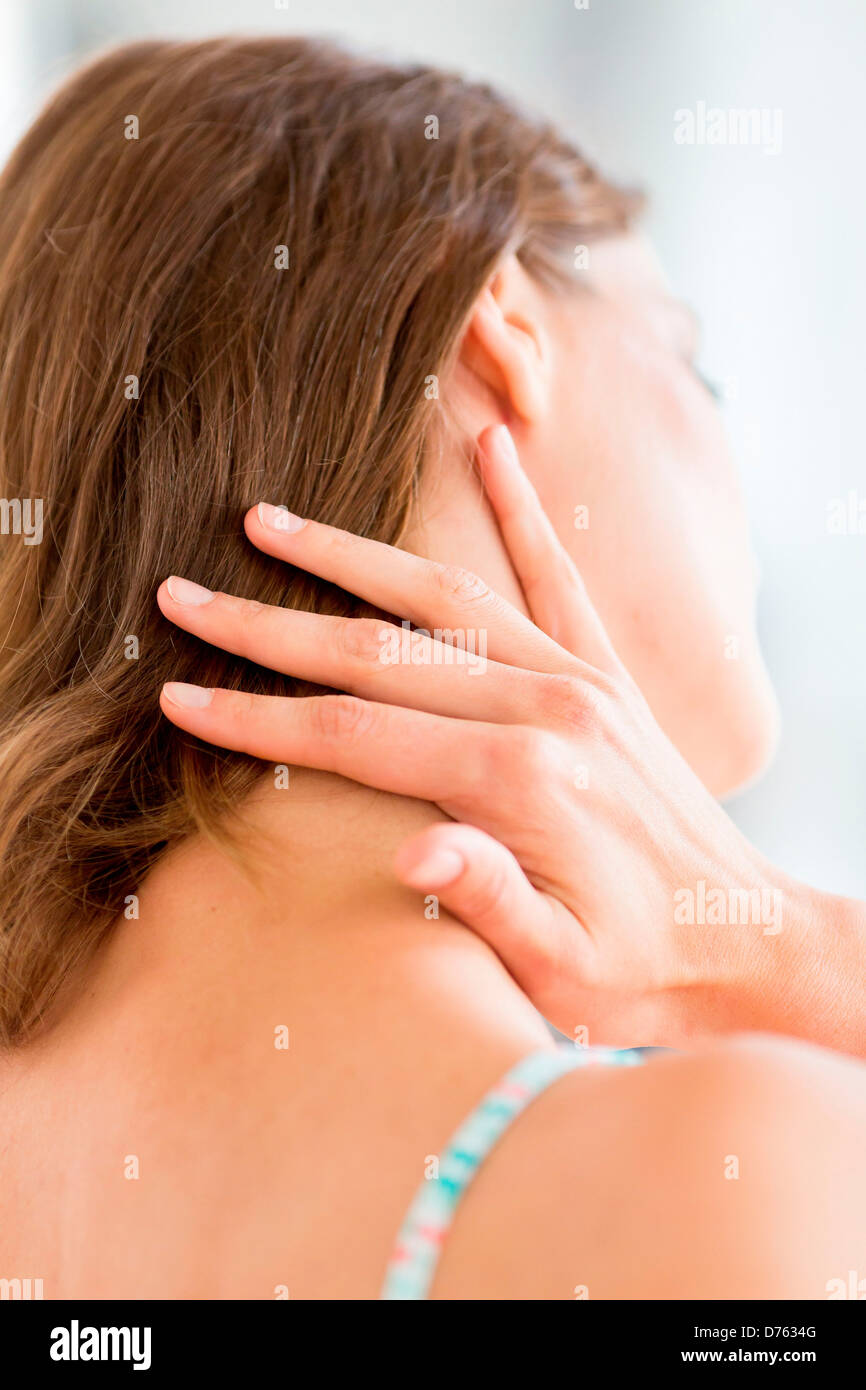 Woman suffering from neck pain. Stock Photo