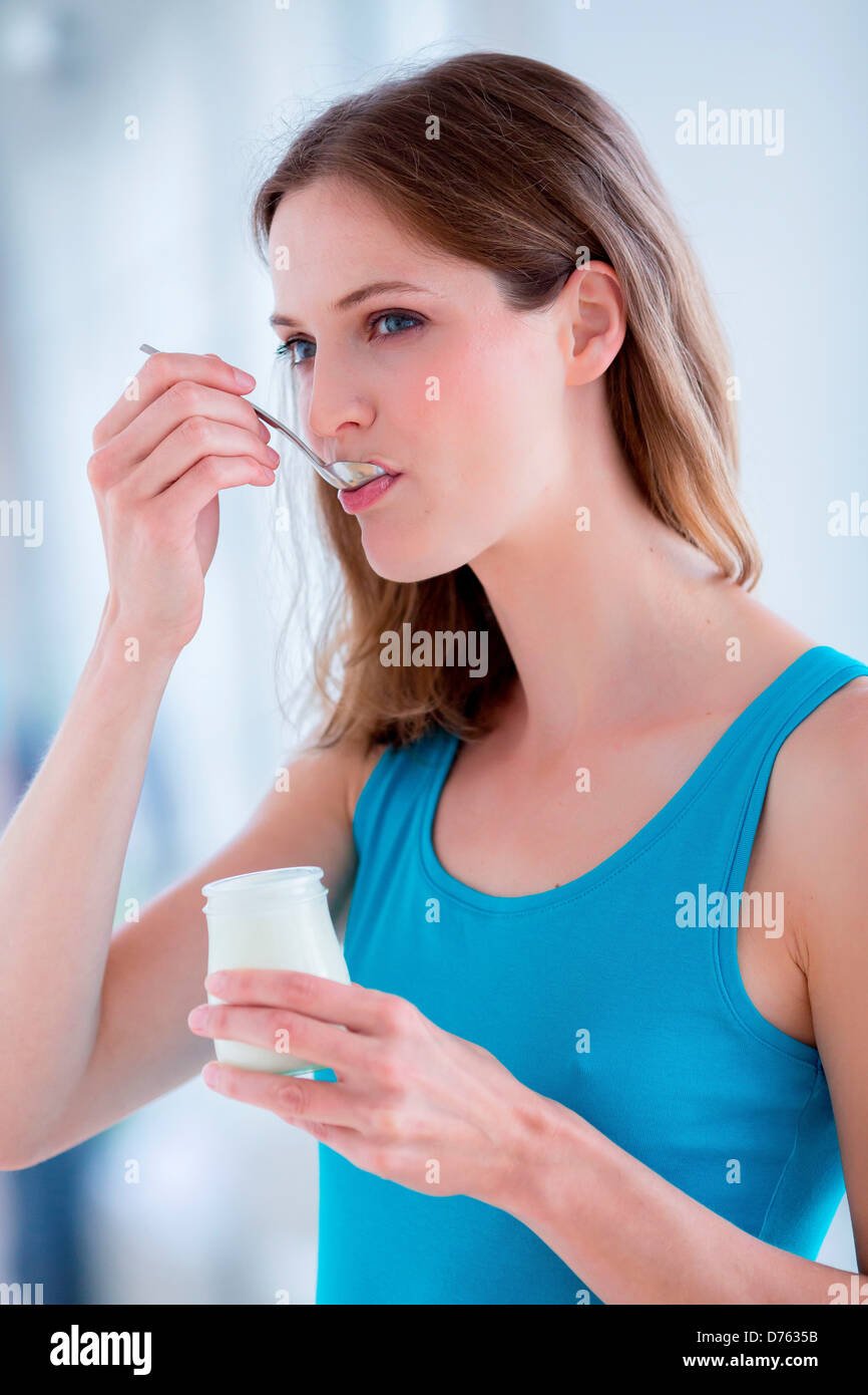 Woman Eating Yogurt Stock Photo Alamy woman-eating-yogurt-stock-photo-alamy
