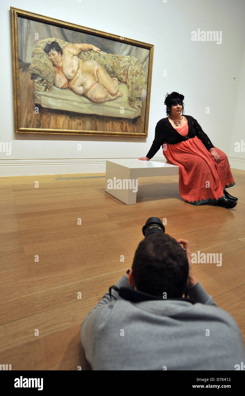 Model Sue Tilley poses in front of a painting depicting