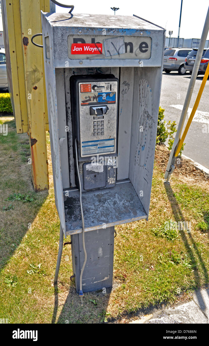 vandalized pay telephone in South San Francisco, California, USA Stock Photo