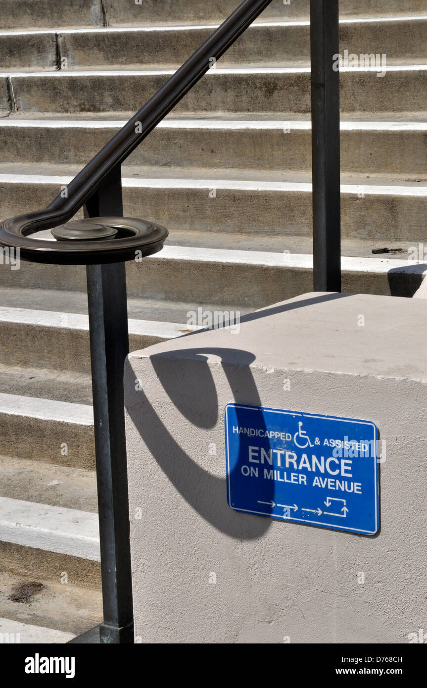 handicapped assisted entrance direction sign Stock Photo