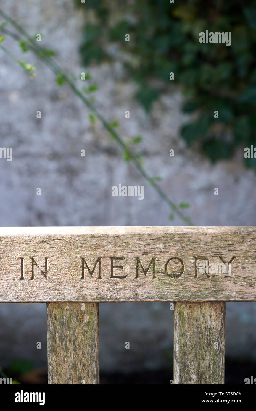 In Memory carved in a garden bench Stock Photo
