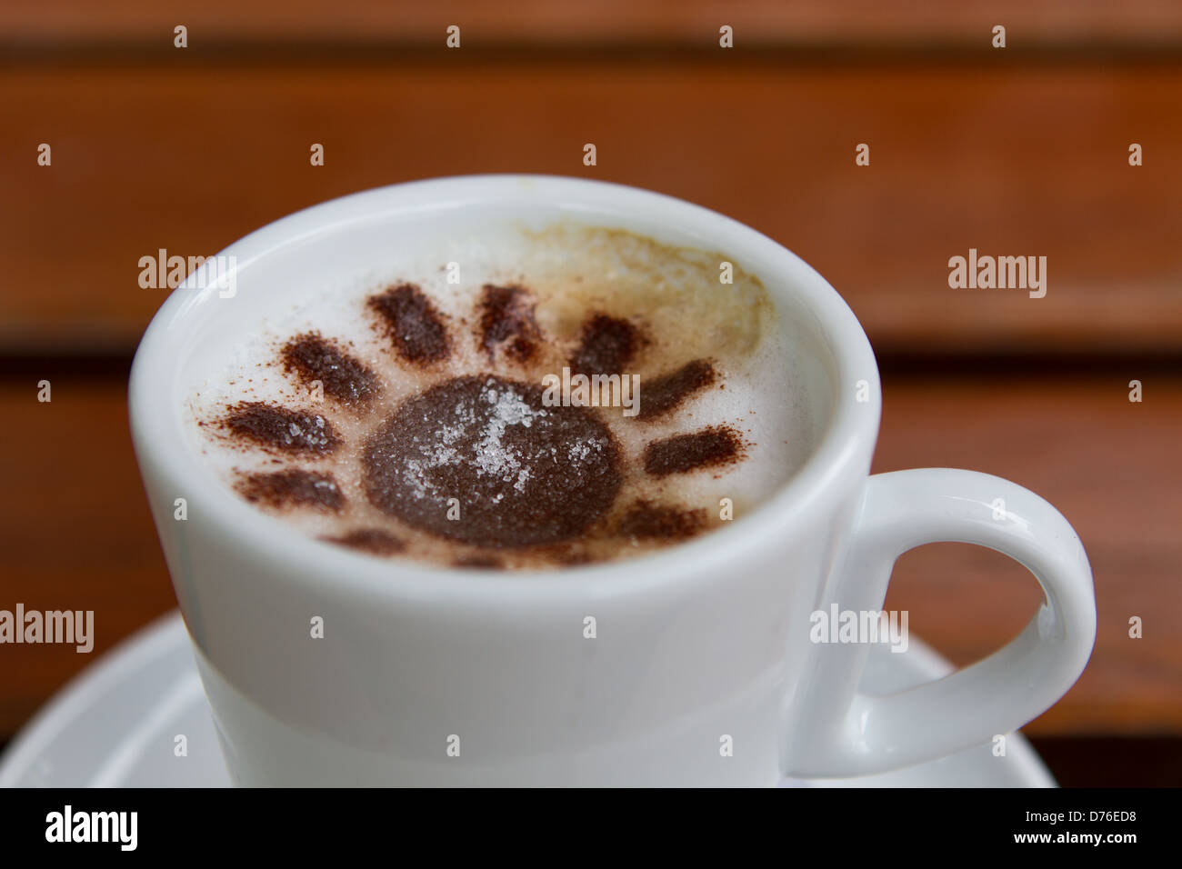 Capuccino coffee cup with chocolate flower pattern Stock Photo